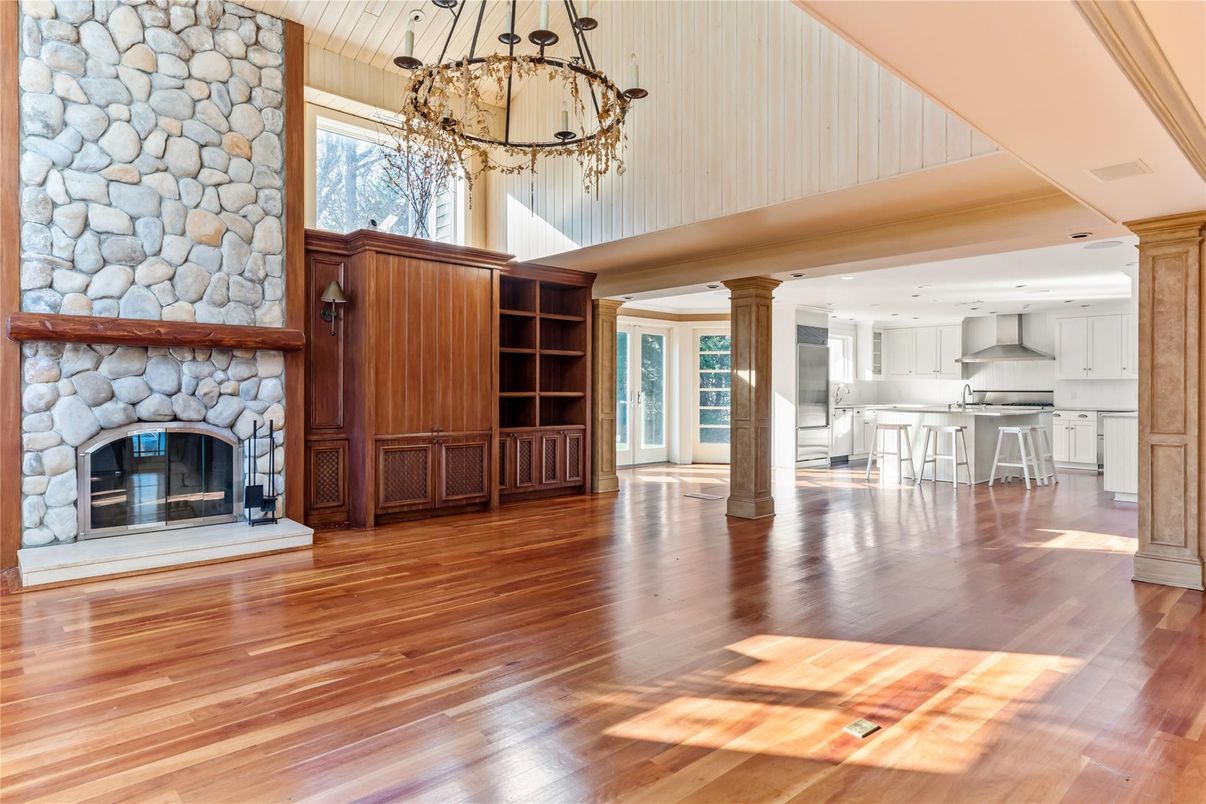 Chandelier, Fireplace, Interior, Kitchen, Pendant Lights, Recessed Lighting, Stone Walls, Wood Texture Flooring