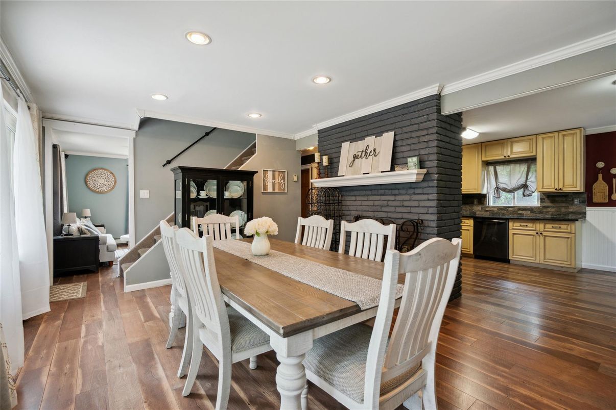 Dining room, Fireplace, Interior, Recessed Lighting, Stone Walls, Wood Texture Flooring