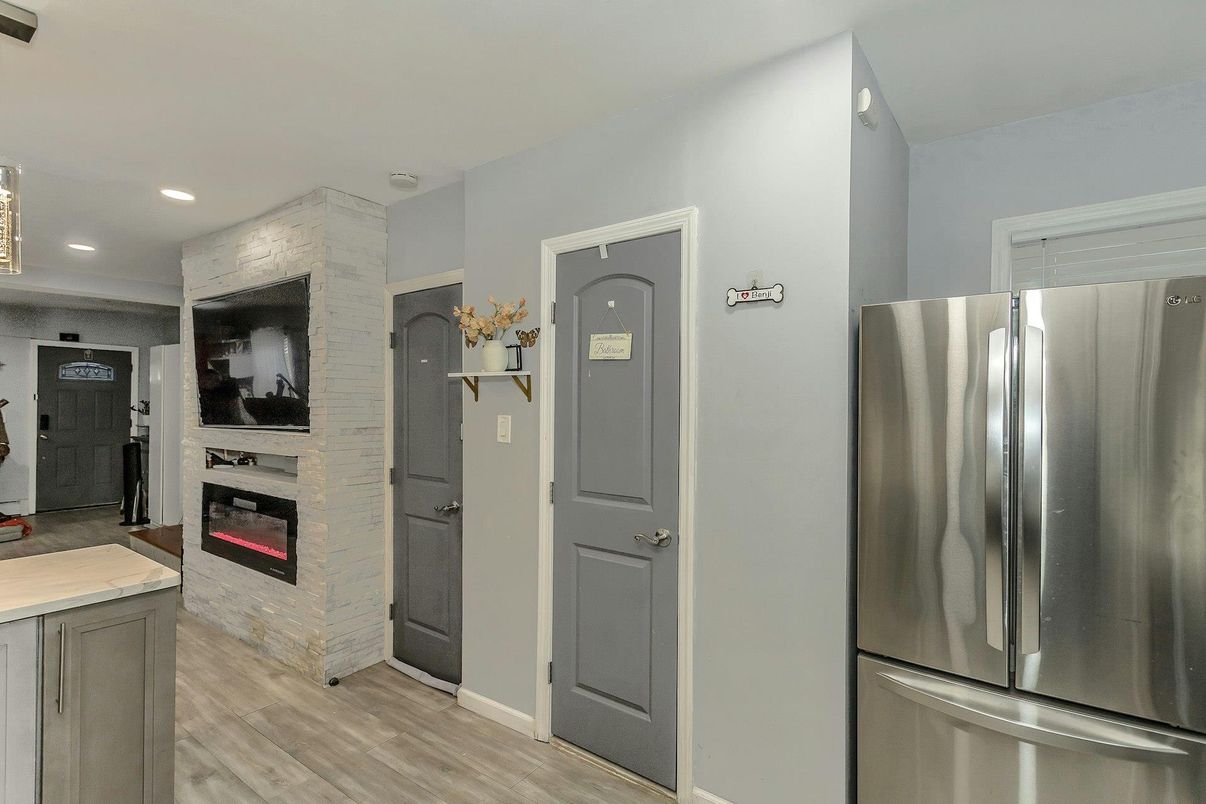 Fireplace, Interior, Kitchen, Recessed Lighting, Stainless Steel Appliances, Wood Texture Flooring