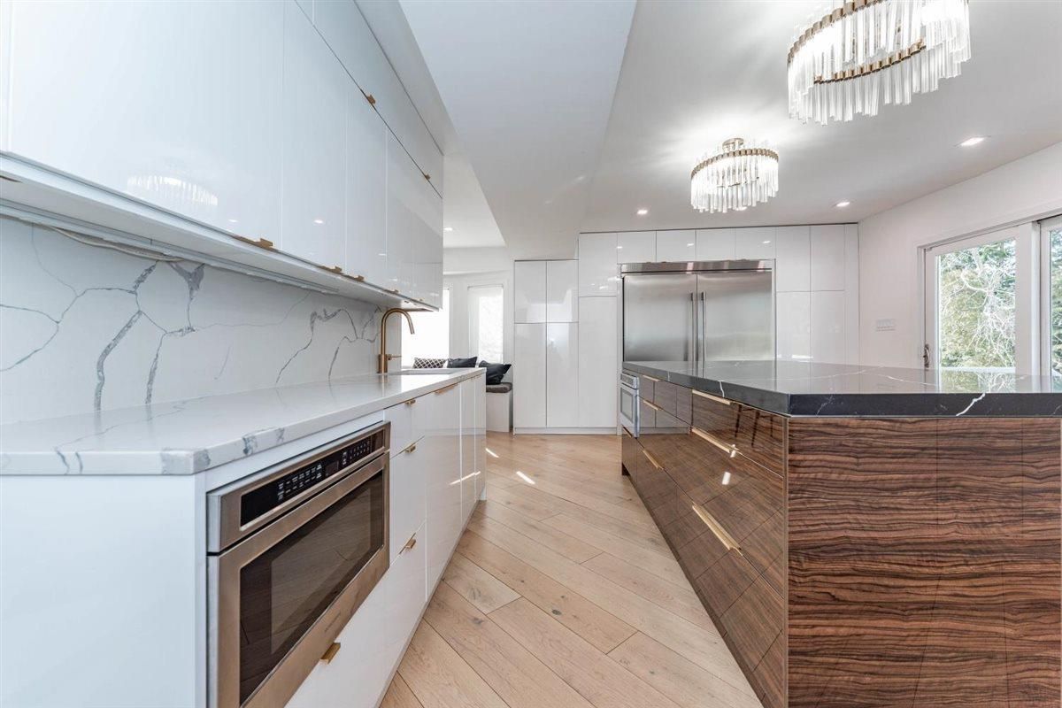 Chandelier, Interior, Kitchen, Marble Walls, Recessed Lighting, Stainless Steel Appliances, Wood Texture Flooring