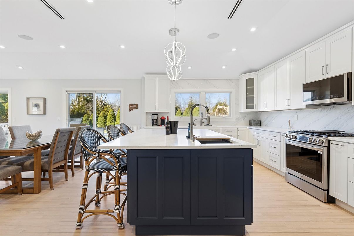 Interior, Kitchen, Marble Walls, Pendant Lights, Recessed Lighting, Stainless Steel Appliances, Wood Texture Flooring