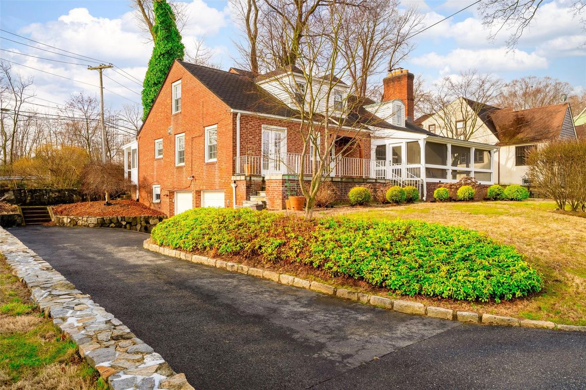 Attached, Backyard, Exterior, Facade, Brick Facade, Cape Cod