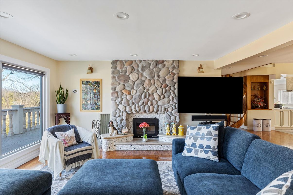 Fireplace, Interior, Living room, Recessed Lighting, Stone Walls, Wood Texture Flooring