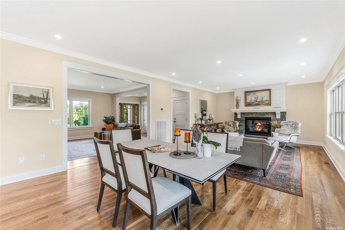 Dining room, Fireplace, Interior, Living room, Recessed Lighting, Wood Texture Flooring