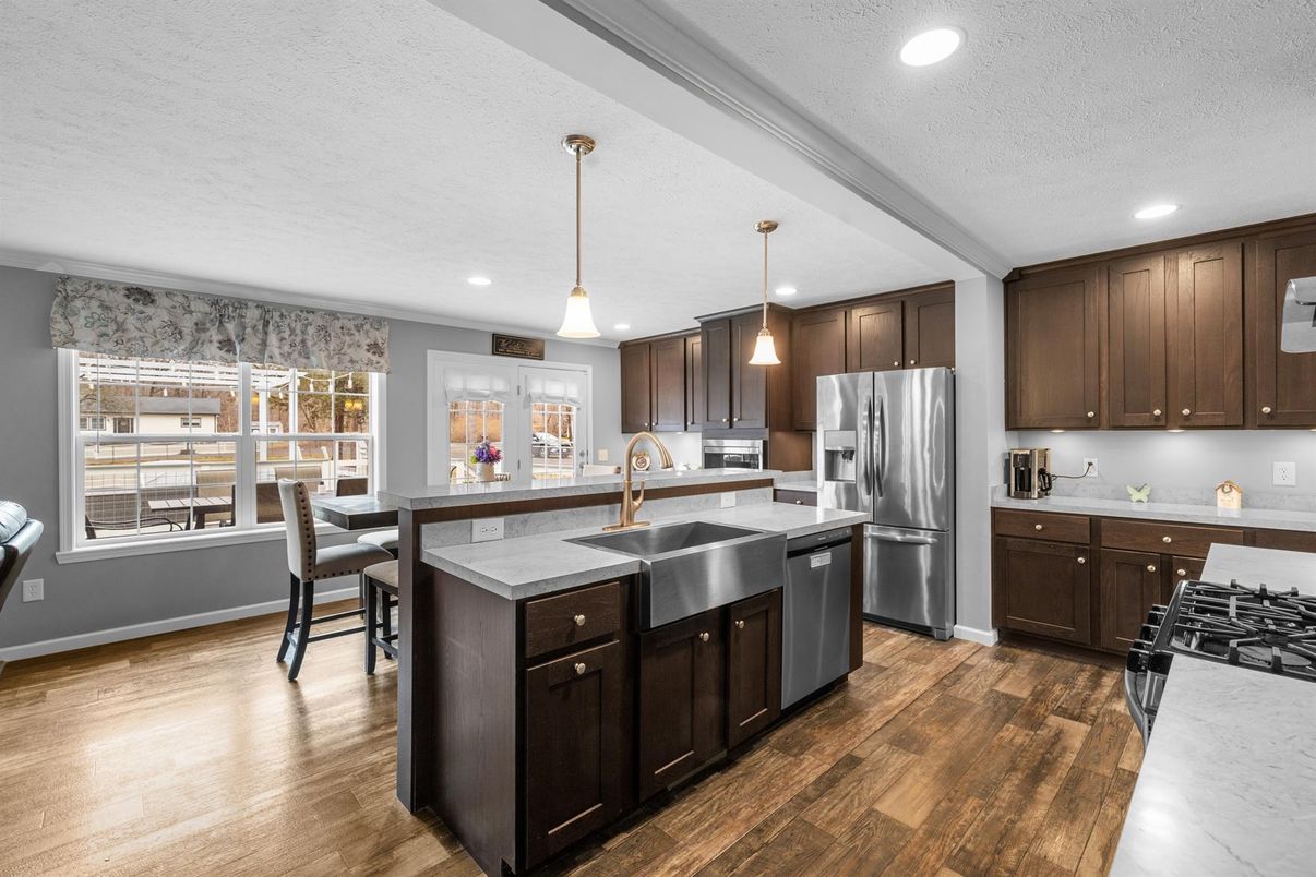 Dining room, Interior, Kitchen, Pendant Lights, Recessed Lighting, Stainless Steel Appliances, Wood Texture Flooring