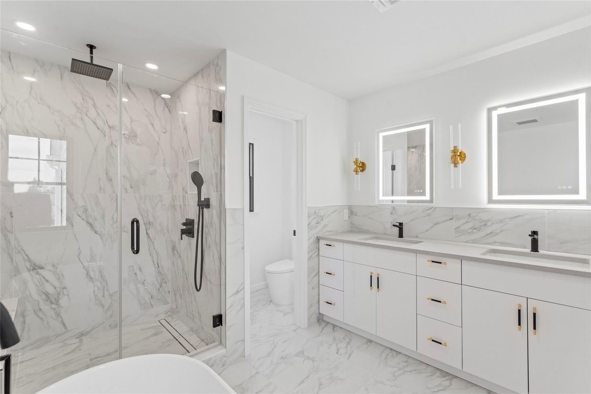 Bathroom, Dual Sink Vanities, Glass Shower, Interior, Marble, Marble Walls, Recessed Lighting