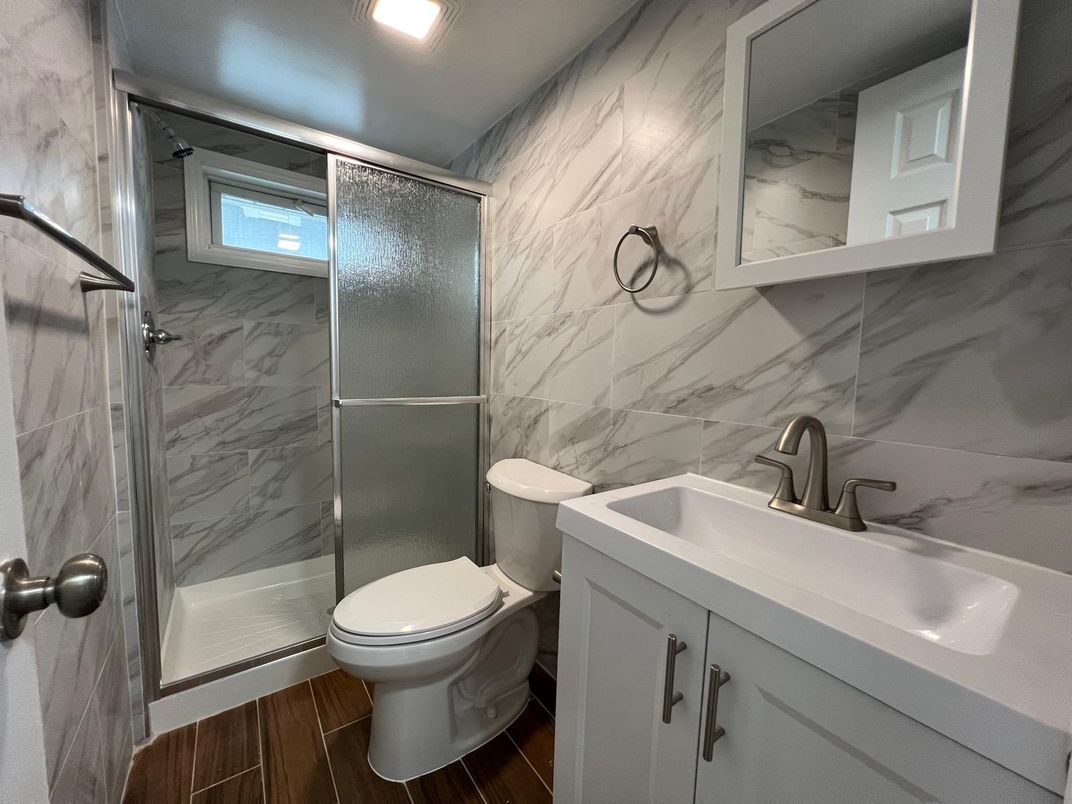 Bathroom, Glass Shower, Interior, Marble Walls, Recessed Lighting, Wood Texture Flooring