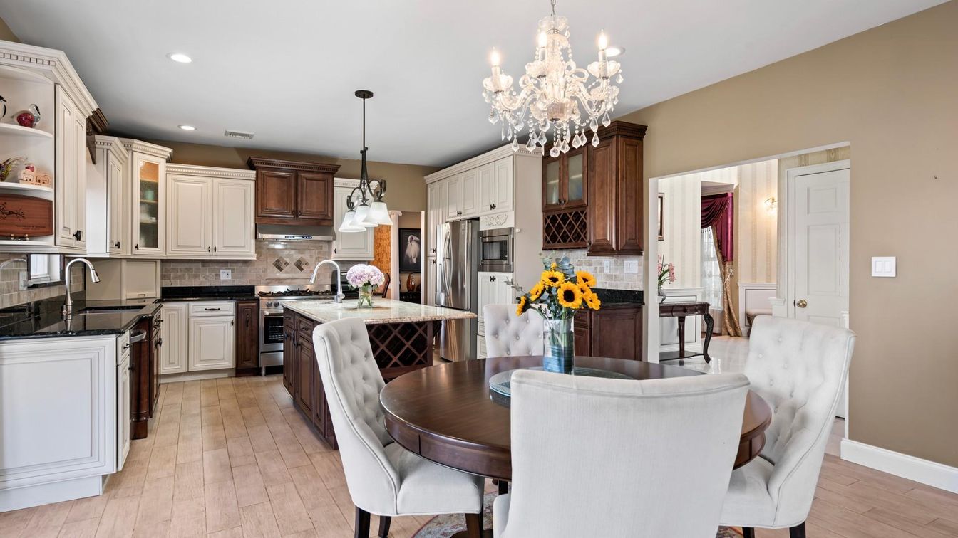 Chandelier, Dining room, Interior, Kitchen, Pendant Lights, Recessed Lighting, Stainless Steel Appliances, Wood Texture Flooring