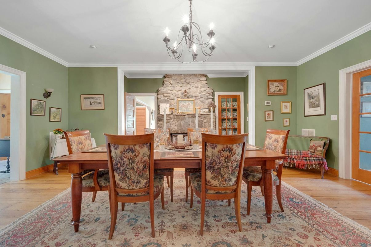 Chandelier, Dining room, Fireplace, Interior, Stone Walls, Wood Texture Flooring