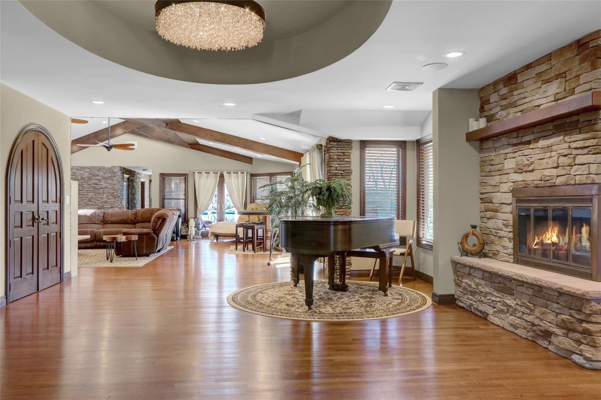 Fireplace, Interior, Living room, Piano, Recessed Lighting, Stone Walls, Wooden Beams, Wood Texture Flooring