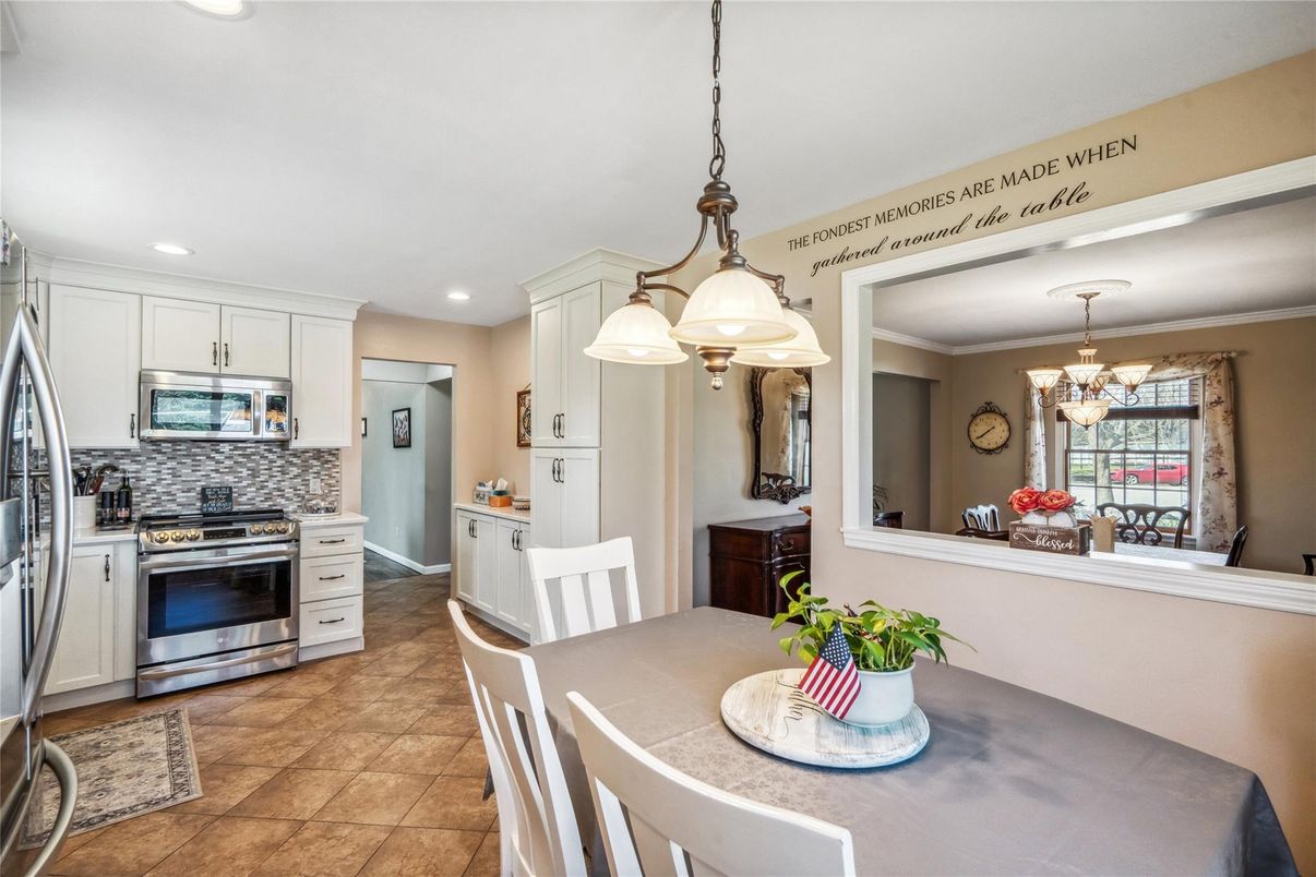 Chandelier, Dining room, Interior, Kitchen, Pendant Lights, Recessed Lighting, Stainless Steel Appliances