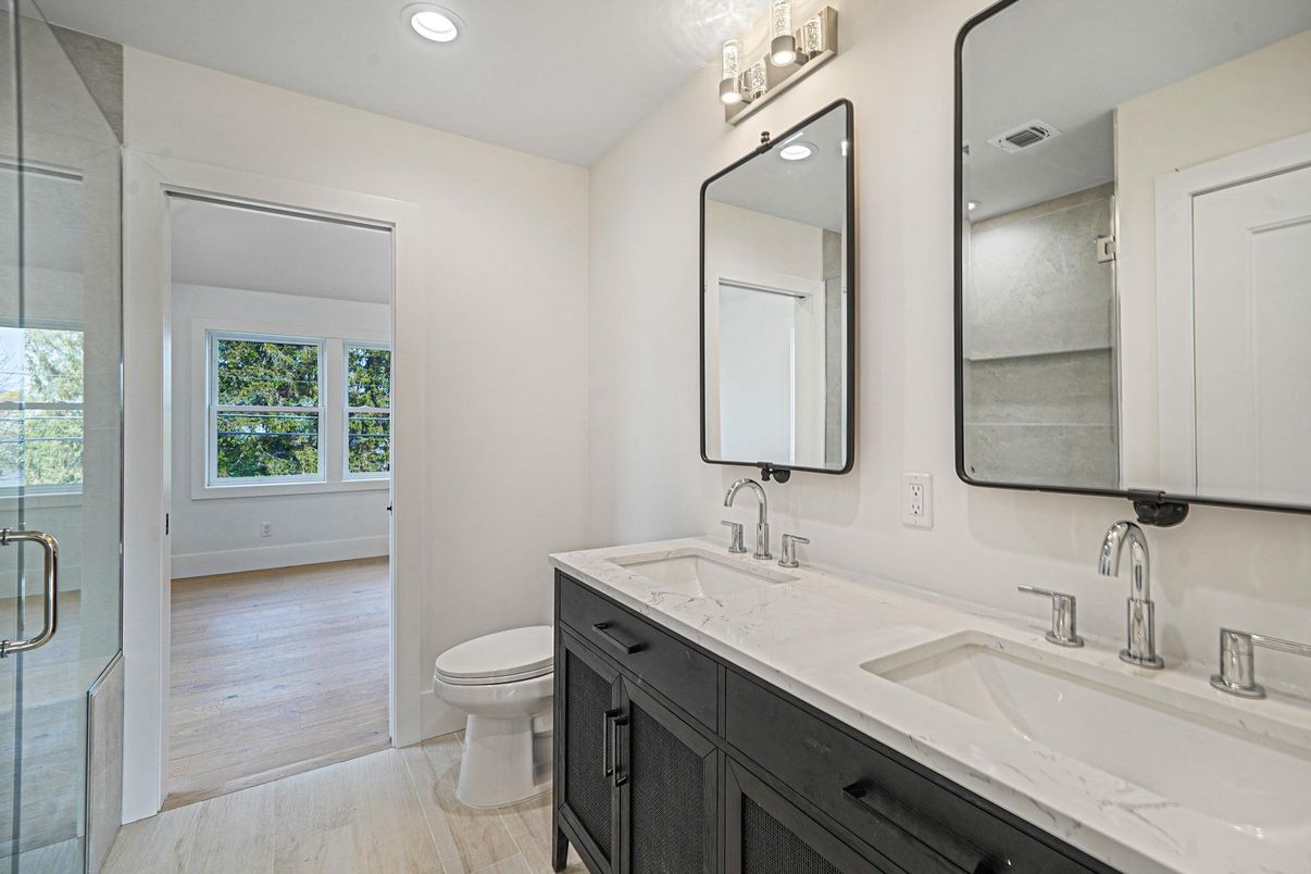 Bathroom, Dual Sink Vanities, Glass Shower, Interior, Recessed Lighting, Wood Texture Flooring