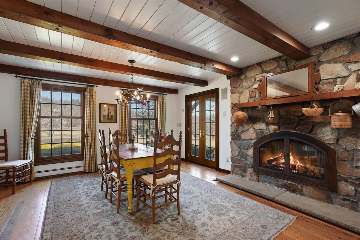 Chandelier, Dining room, Fireplace, Interior, Pendant Lights, Recessed Lighting, Stone Walls, Wooden Beams, Wood Texture Flooring