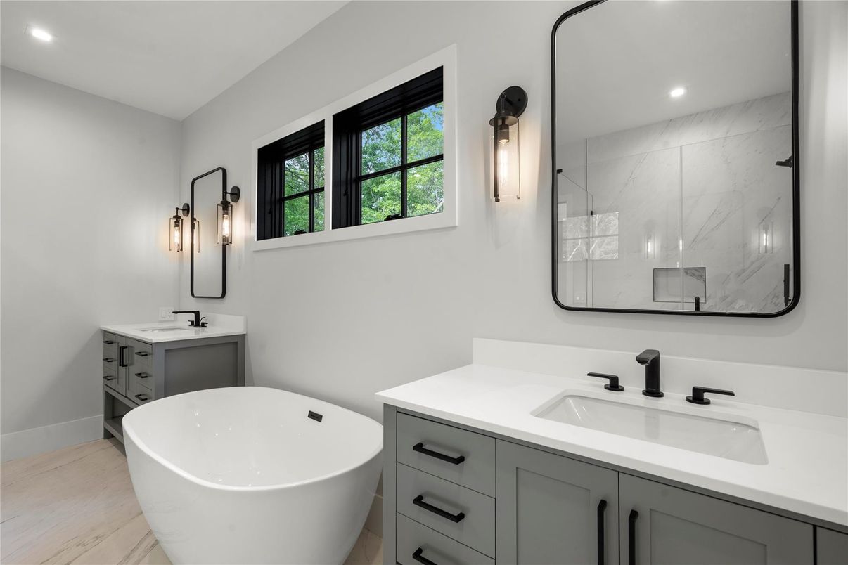 Bathroom, Dual Sink Vanities, Free Standing Baths, Interior, Marble Walls, Recessed Lighting, Wood Texture Flooring