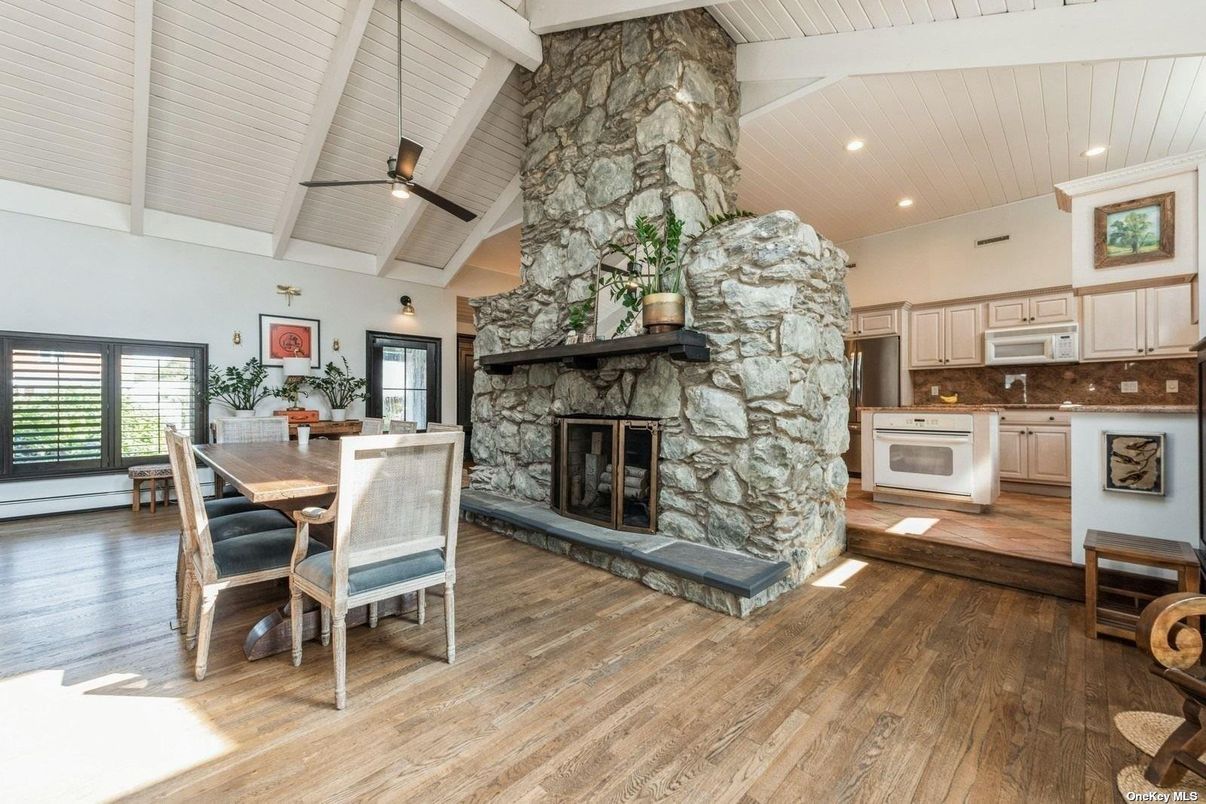 Dining room, Fireplace, Interior, Kitchen, Recessed Lighting, Stone Walls, Wood Texture Flooring