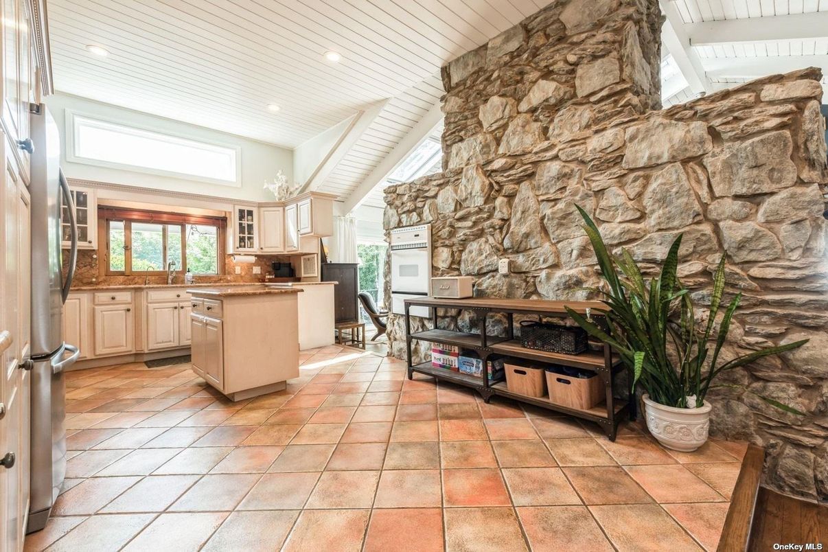 Fireplace, Interior, Kitchen, Recessed Lighting, Stainless Steel Appliances, Stone Walls