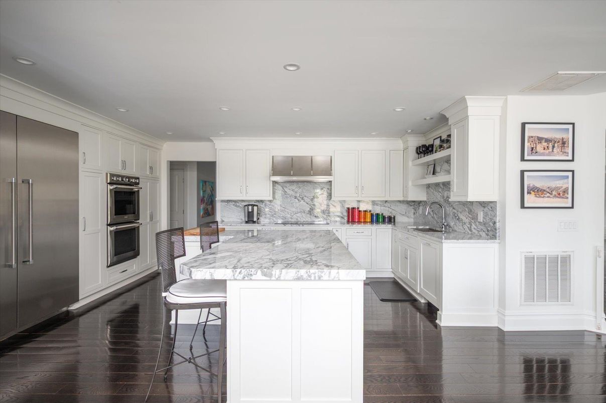 Interior, Kitchen, Marble Walls, Recessed Lighting, Stainless Steel Appliances, Wood Texture Flooring