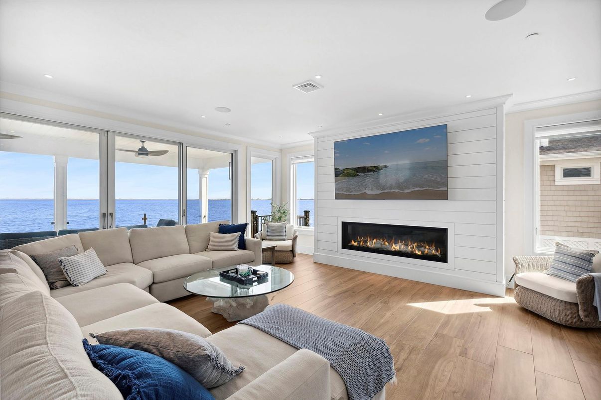 Fireplace, Interior, Living room, Recessed Lighting, Water, Wood Texture Flooring