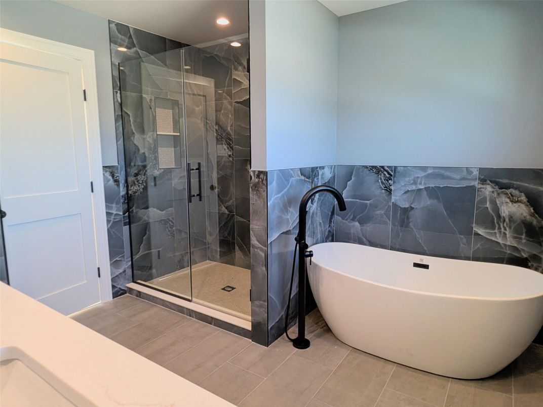 Bathroom, Free Standing Baths, Glass Shower, Interior, Recessed Lighting, Wood Texture Flooring