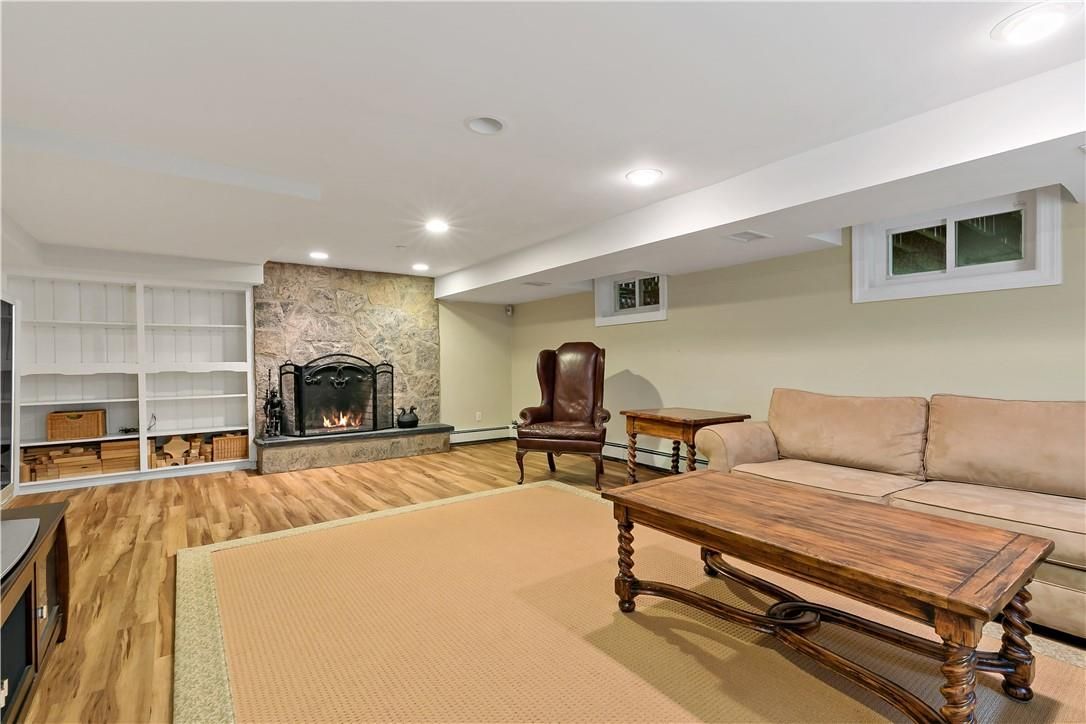 Fireplace, Interior, Living room, Recessed Lighting, Stone Walls, Wood Texture Flooring