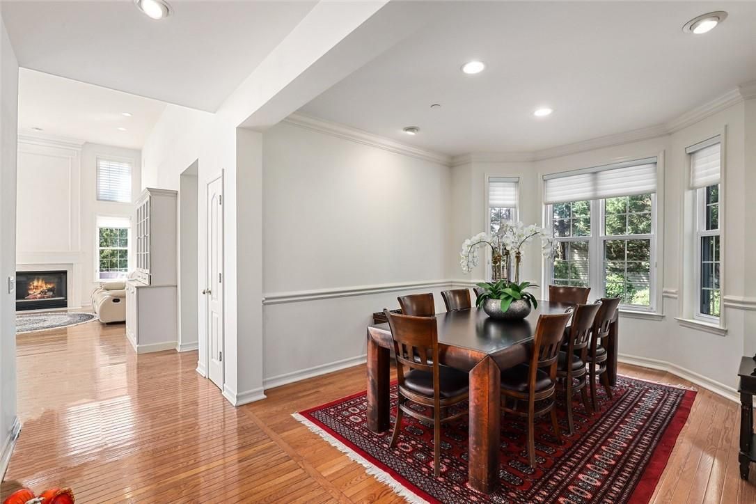 Dining room, Fireplace, Interior, Living room, Recessed Lighting, Wood Texture Flooring