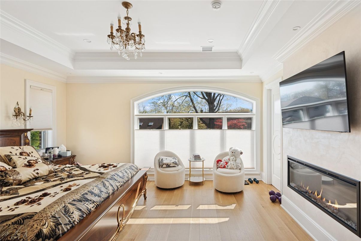 Bedroom, Chandelier, Fireplace, Interior, Recessed Lighting, Wood Texture Flooring