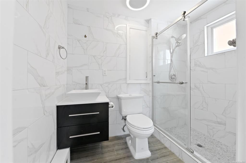 Bathroom, Glass Shower, Interior, Marble Walls, Wood Texture Flooring