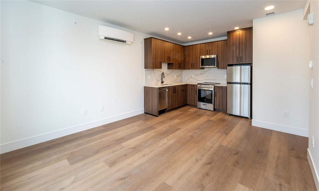 Interior, Kitchen, Marble Walls, Recessed Lighting, Stainless Steel Appliances, Wood Texture Flooring