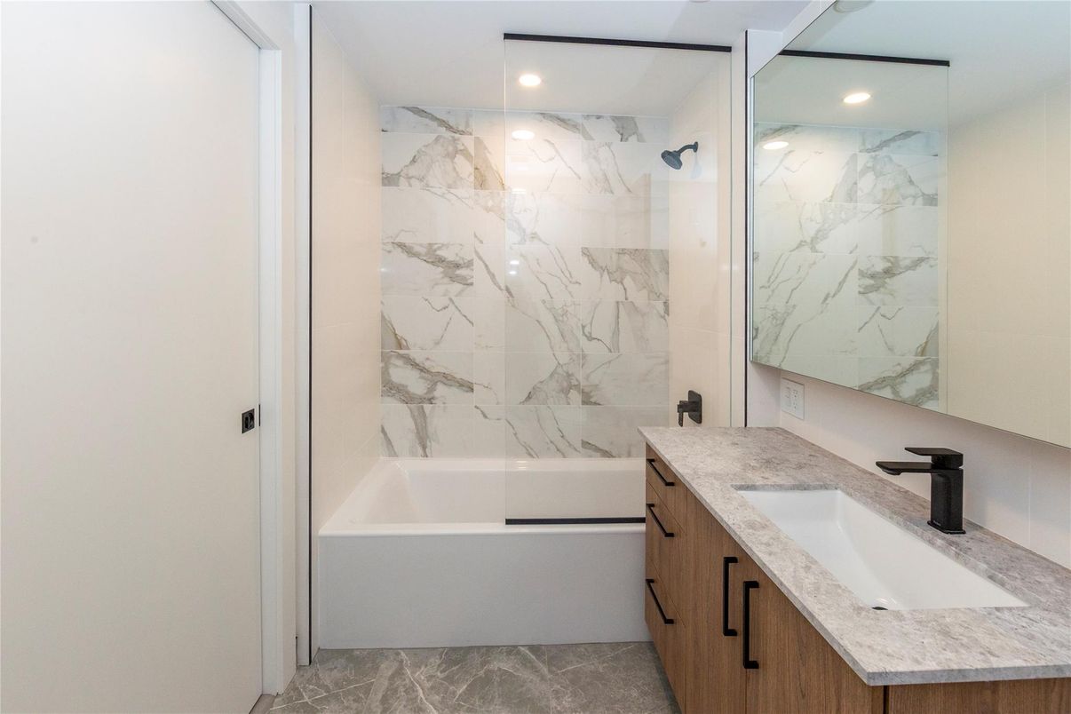 Bathroom, Dual Sink Vanities, Glass Shower, Interior, Marble Walls, Recessed Lighting