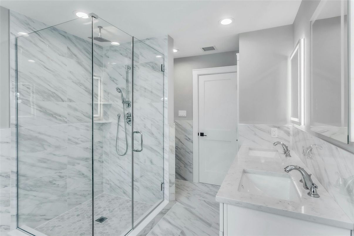 Bathroom, Dual Sink Vanities, Glass Shower, Interior, Marble, Marble Walls, Recessed Lighting