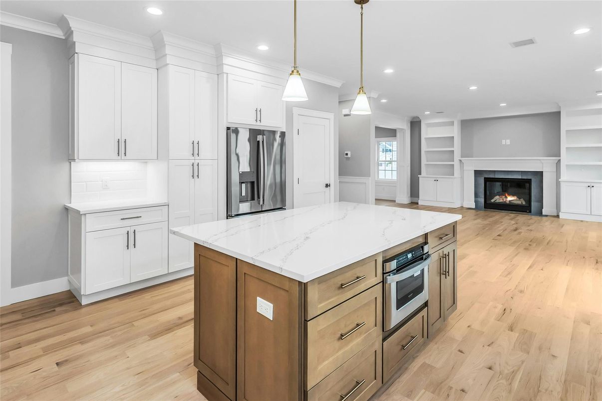 Fireplace, Interior, Kitchen, Pendant Lights, Recessed Lighting, Stainless Steel Appliances, Wood Texture Flooring