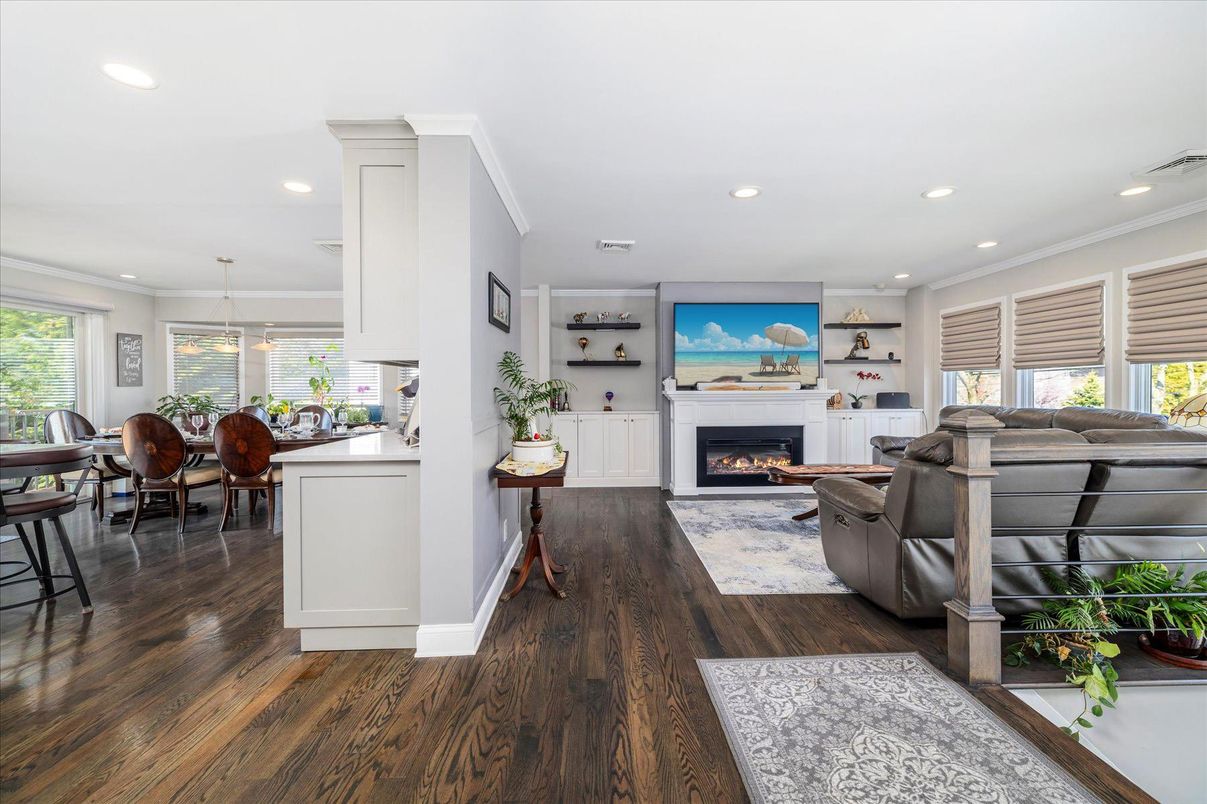 Dining room, Fireplace, Interior, Living room, Pendant Lights, Recessed Lighting, Wood Texture Flooring