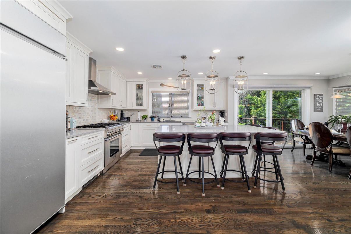 Dining room, Interior, Kitchen, Pendant Lights, Recessed Lighting, Stainless Steel Appliances, Wood Texture Flooring