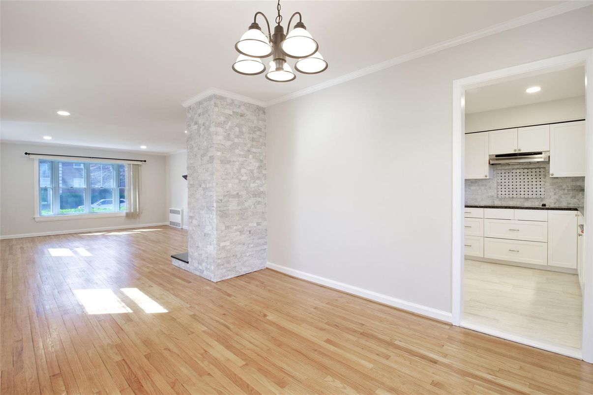 Empty room, Interior, Kitchen, Pendant Lights, Recessed Lighting, Stainless Steel Appliances, Wood Texture Flooring