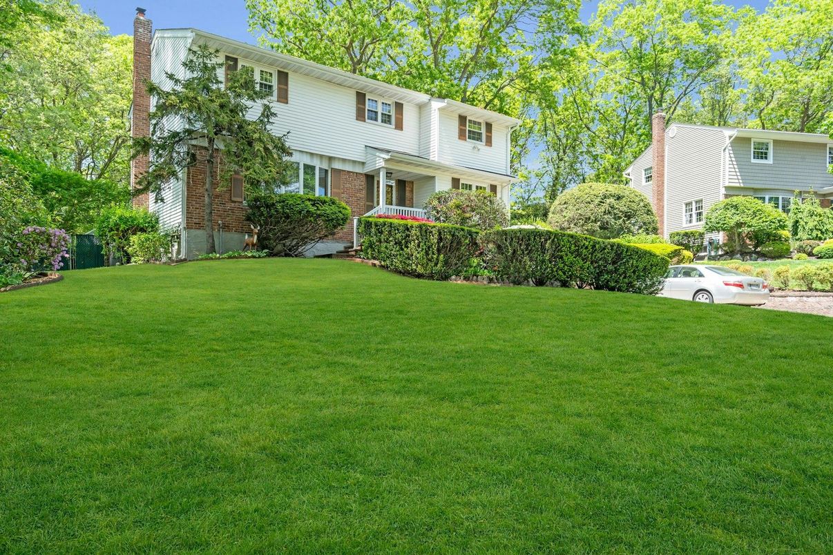 Attached, Backyard, Exterior, Facade, Brick Facade, Raised Ranch