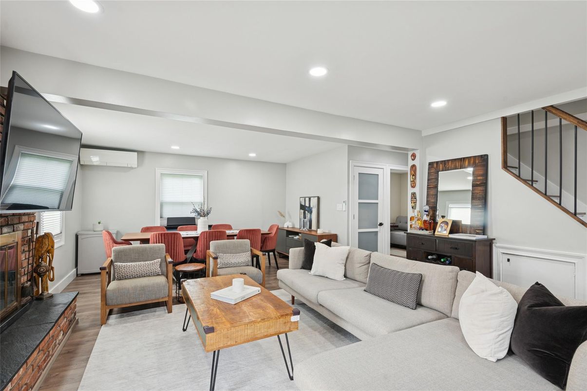 Dining room, Fireplace, Interior, Living room, Recessed Lighting, Wood Texture Flooring
