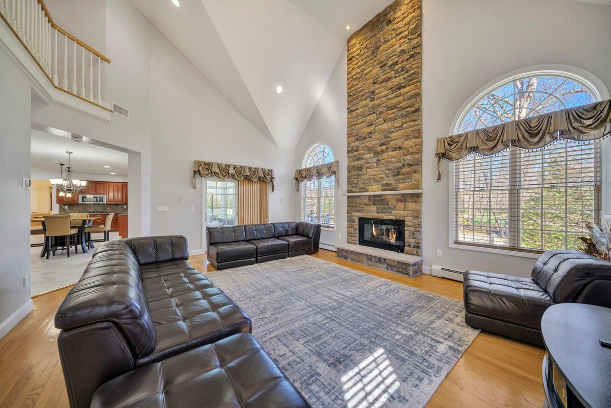 Chandelier, Dining room, Fireplace, Interior, Kitchen, Living room, Recessed Lighting, Stone Walls, Wood Texture Flooring