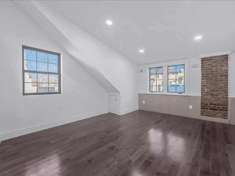 Empty room, Fireplace, Interior, Recessed Lighting, Stone Walls, Wood Texture Flooring