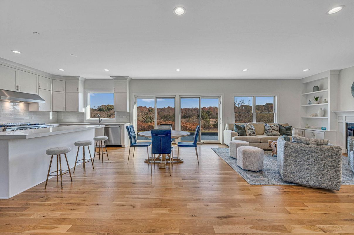Dining room, Fireplace, Interior, Kitchen, Living room, Recessed Lighting, Stainless Steel Appliances, Wood Texture Flooring