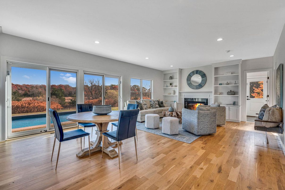 Dining room, Fireplace, Interior, Living room, Recessed Lighting, Wood Texture Flooring