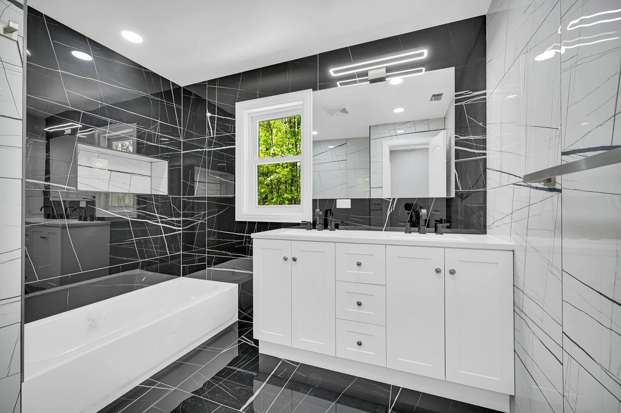 Bathroom, Dual Sink Vanities, Glass Shower, Interior, Marble Walls, Recessed Lighting