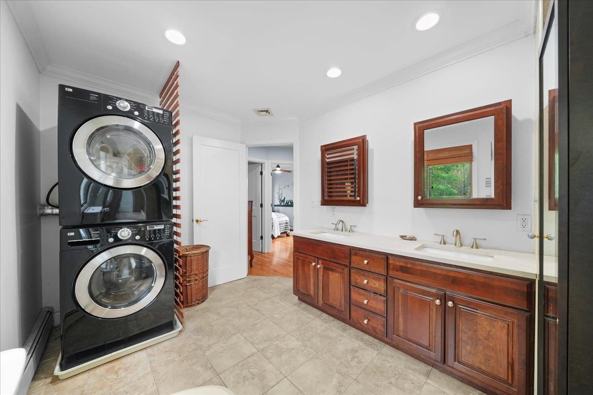 Bathroom, Dual Sink Vanities, Interior, Recessed Lighting, Utility Closets, Washer, Wood Texture Flooring