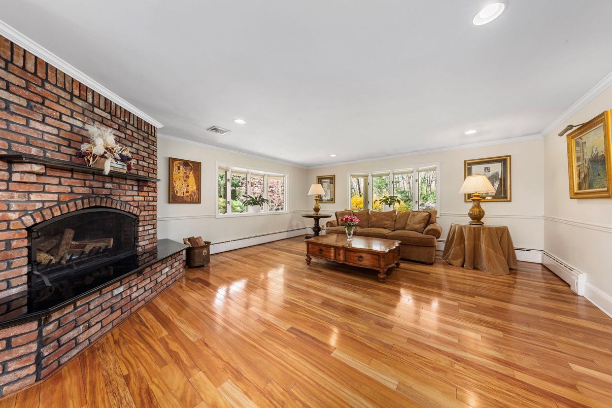 Fireplace, Interior, Living room, Recessed Lighting, Stone Walls, Wood Texture Flooring
