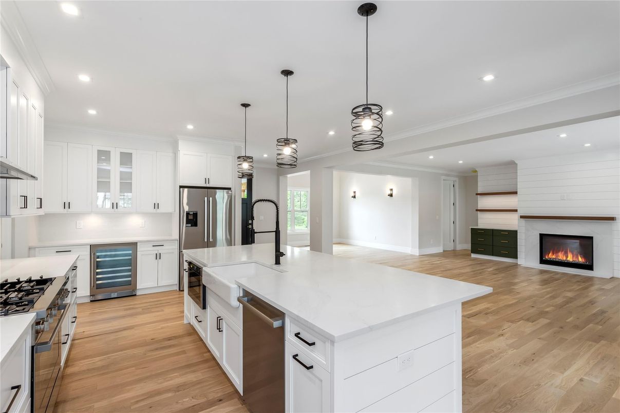 Fireplace, Interior, Kitchen, Pendant Lights, Recessed Lighting, Stainless Steel Appliances, Wood Texture Flooring