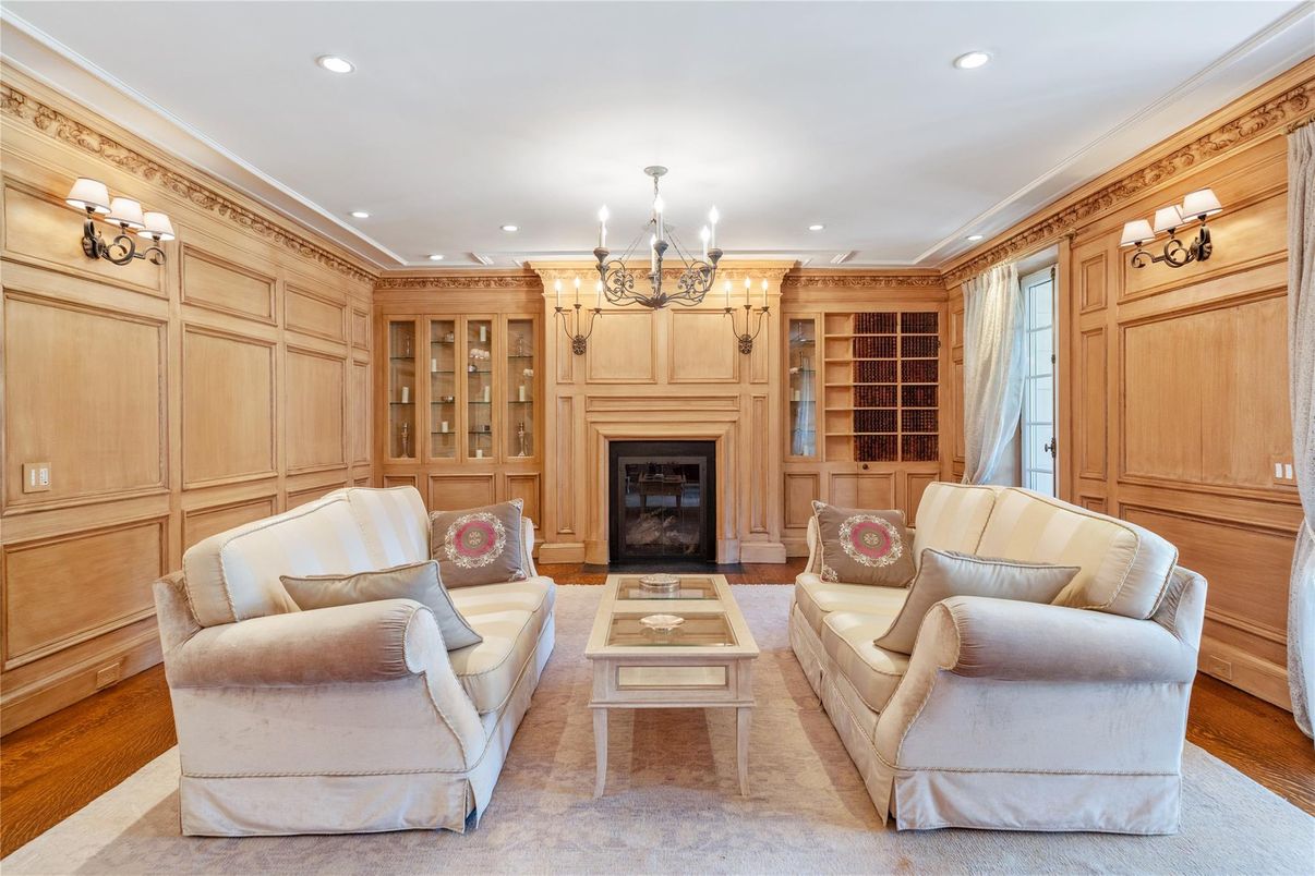 Chandelier, Fireplace, Interior, Living room, Recessed Lighting, Wood Texture Flooring, Wooden Walls
