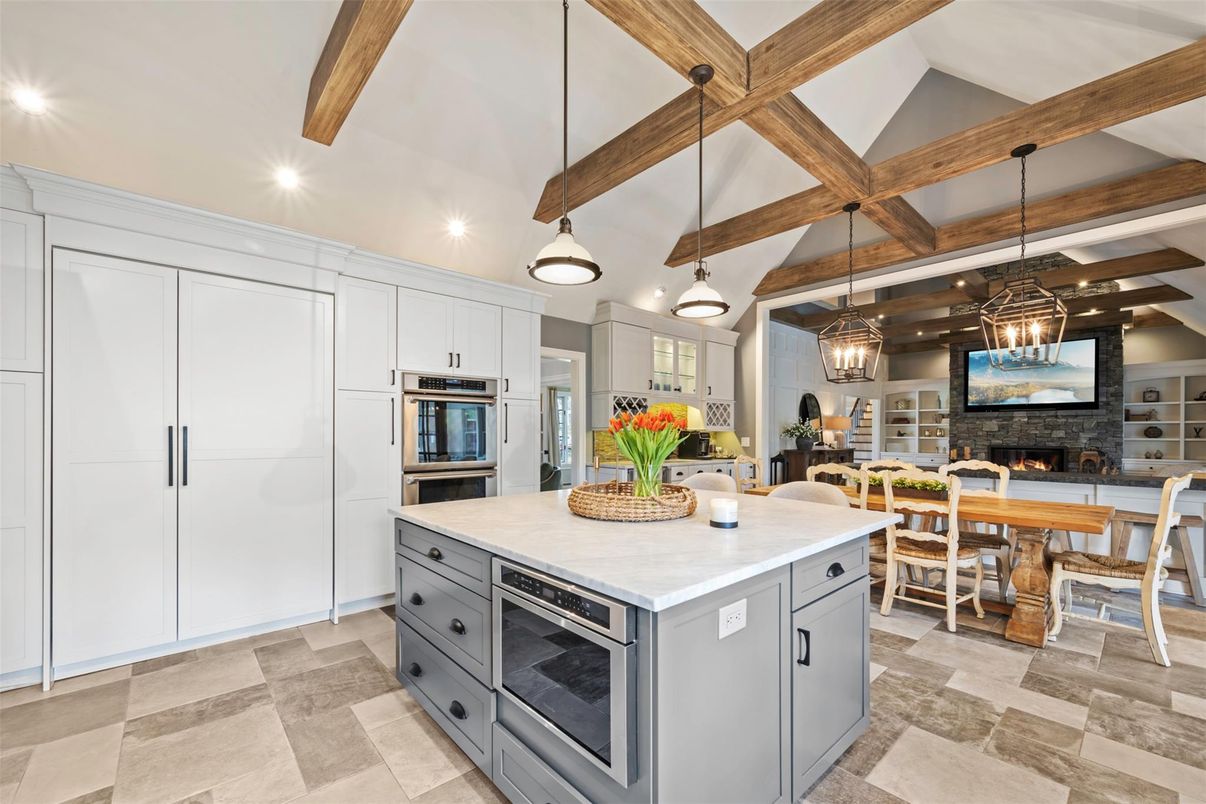 Dining room, Fireplace, Interior, Kitchen, Pendant Lights, Recessed Lighting, Stainless Steel Appliances, Stone Walls, Wooden Beams