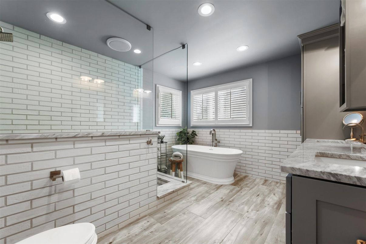 Bathroom, Dual Sink Vanities, Free Standing Baths, Interior, Pendant Lights, Recessed Lighting, Wood Texture Flooring