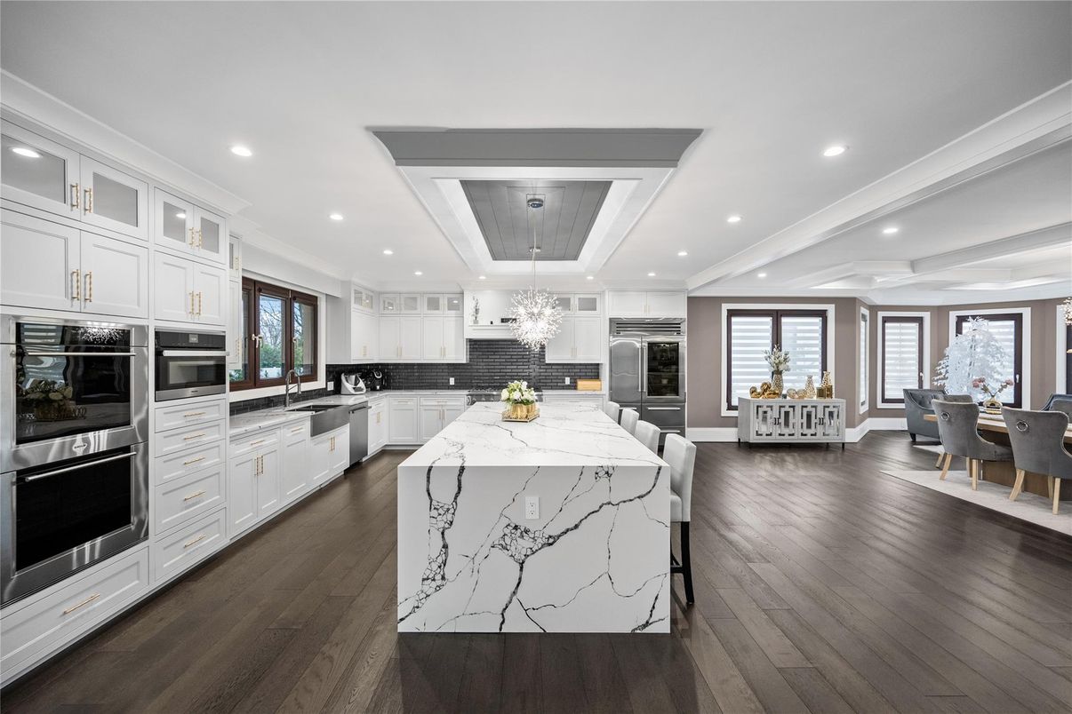 Chandelier, Dining room, Interior, Kitchen, Recessed Lighting, Stainless Steel Appliances, Wooden Ceilings, Wood Texture Flooring