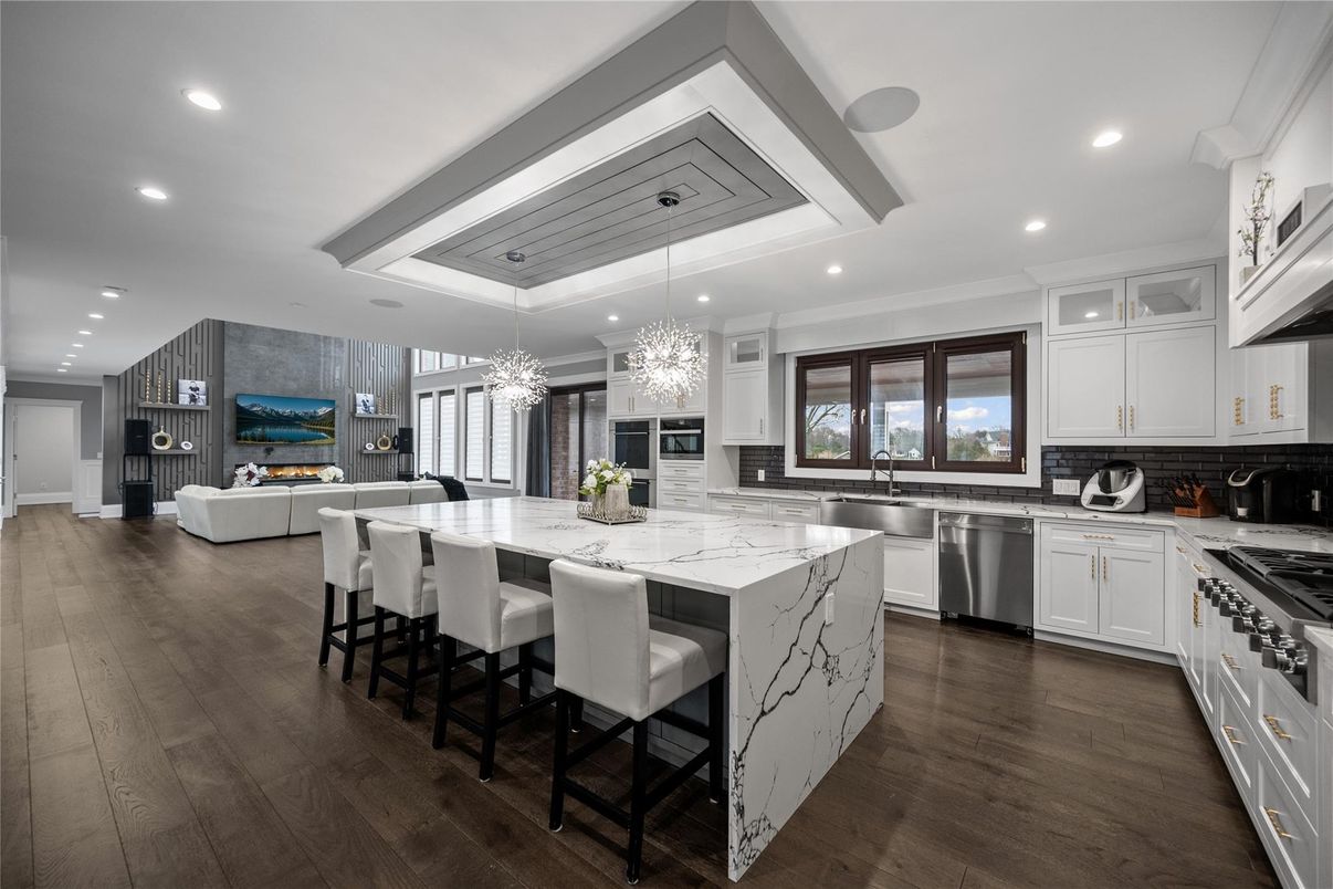 Chandelier, Fireplace, Interior, Kitchen, Living room, Recessed Lighting, Stainless Steel Appliances, Wood Texture Flooring