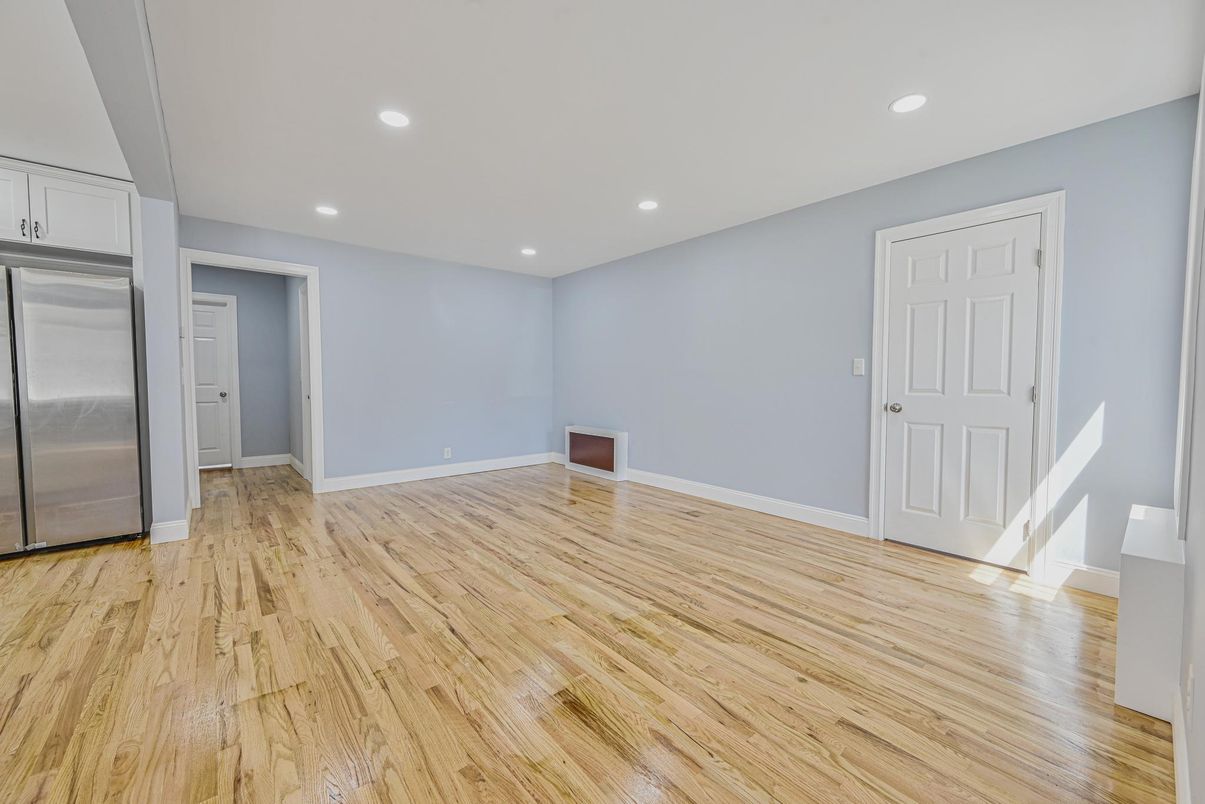 Empty room, Interior, Recessed Lighting, Stainless Steel Appliances, Wood Texture Flooring